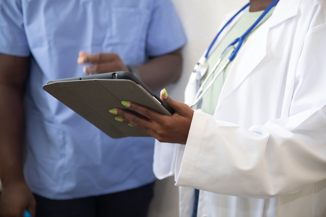 Black doctor consulting with a patient in a hospital