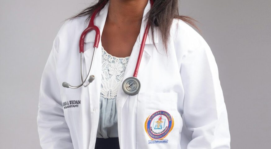 Black female doctor wearing a white coat and stethoscope